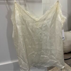 Cream medium BP silky tank blouse. Lace trim around neckline. New with tags.